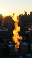 steam industry at sunset
