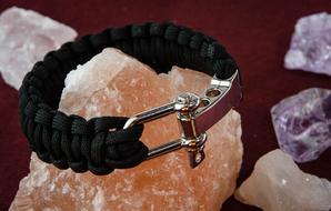 Black and metal bracelet on the beautiful and colorful minerals