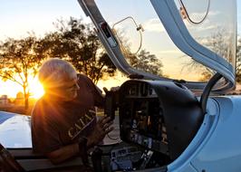 Old Man working with plane