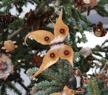 vintage decoration in the form of a butterfly on a christmas tree