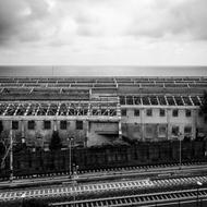 black and white, railway on the background of an industrial plant, liguria