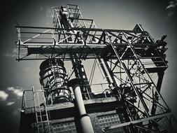 black and white photo of a metal structure in the port