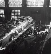 locomotive under repair in black and white background