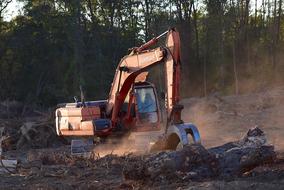 excavator at a construction site in the forest