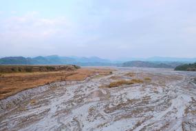Beautiful and colorful landscape with the construction land in fog