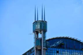 elevator with spiers near a modern skyscraper