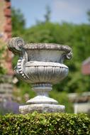 greek vessel in the garden on a blurred background
