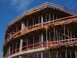 Colorful house with the scaffold, under the blue sky with clouds, in New Ulm