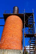 Industrial fireplace with the chimney and stairs