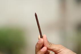 Metal Nail in hand