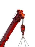 Close-up of the orange crane, on a site, at white background