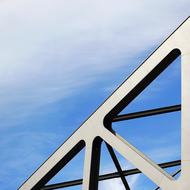 Beautiful, metal bridge at blue sky with white clouds on background