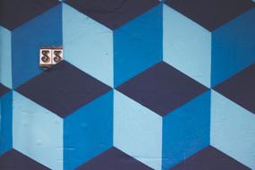 Poster with blue cubes with shadows and number "33"