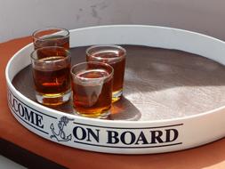 Shiny Glasses of brandy, on the tray, in light