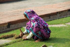 Indian woman working on the lawn