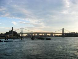 steel bridge in the harbor against the backdrop of city buildings