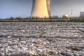 Close-up of the colorful stones, near the cooling tower of the nuclear power plant, on the landscape