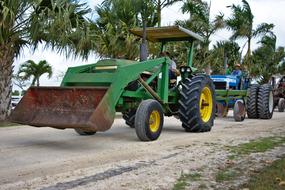 green tractor with big bucket