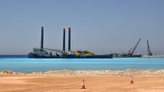 heavy construction cranes over water