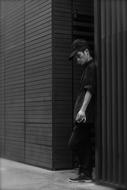 smoking worker near the wall in black and white background