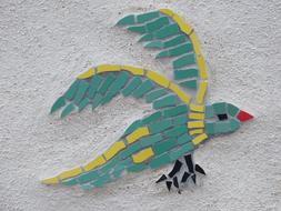 bird as a mosaic on the wall