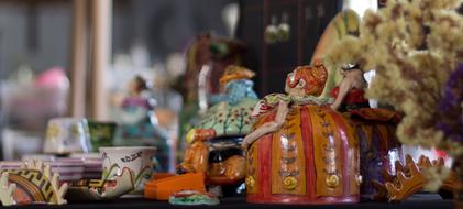 ceramic figurines on table with blurred background