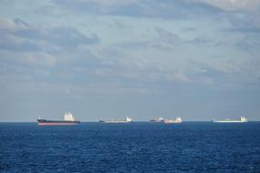 distant view of bulk carriers on the horizon in the north sea