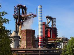industrial chimneys on a blue sky background