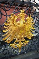 golden eagle as a decoration on a wrought-iron fence