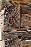 Close-up of the colorful wood construction with the logs in connection