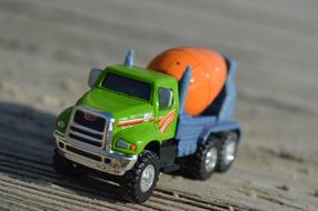 Colorful, shiny model of the cement truck, in light