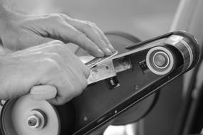 person Sharpening Knife on machine