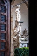 sculpture behind the door