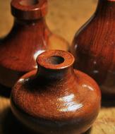 Close-up of the beautiful, shiny, brown pottery bottles