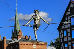 Beautiful, shiny sculpture in Bydgoszcz, Poland, under the blue sky with clouds