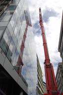 Reflection of Crane on glass Building