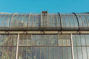 glass greenhouse architecture on a sunny day