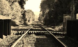 endless railroad tracks in monochrome