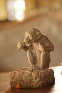 Beautiful, wood sculpture of the money, at blurred background