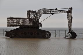 Sculpture of the excavator, on the shore of the sea in Middelkerke, Belgium
