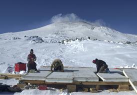 workers in antarctica on a sunny day