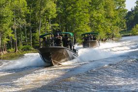 military teams on boats on a sunny day