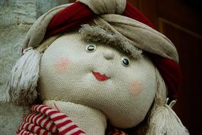 Portrait of the cute, beautiful and colorful doll with red lips