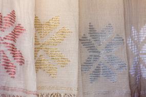 flowers as embroidery on linen fabric