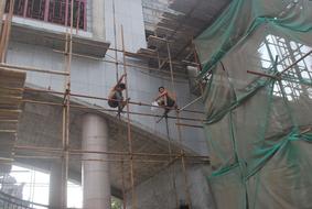 workers on Scaffolding Platform