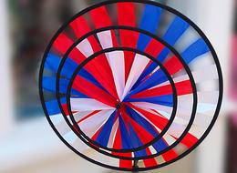 Beautiful circle pattern with blue, red and white ribbons in