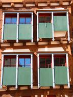Beautiful and colorful Truss house with green shutters