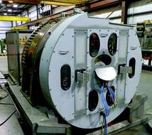 Close-up of the shiny railroad generator machine, on the test stand