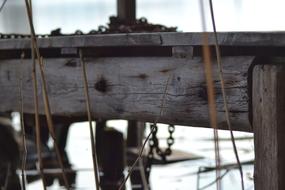 Rusty chains on old wooden pier