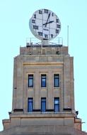 round clock at top of old building